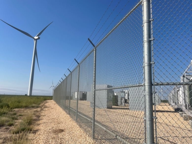 Wind turbines create energy that is fed into this battery energy storage site in Scurry County, Texas until it is needed.