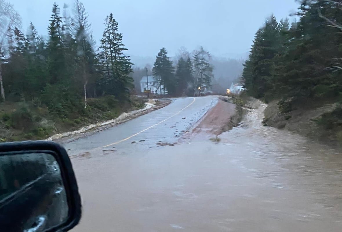 A road is washed out with muddy water